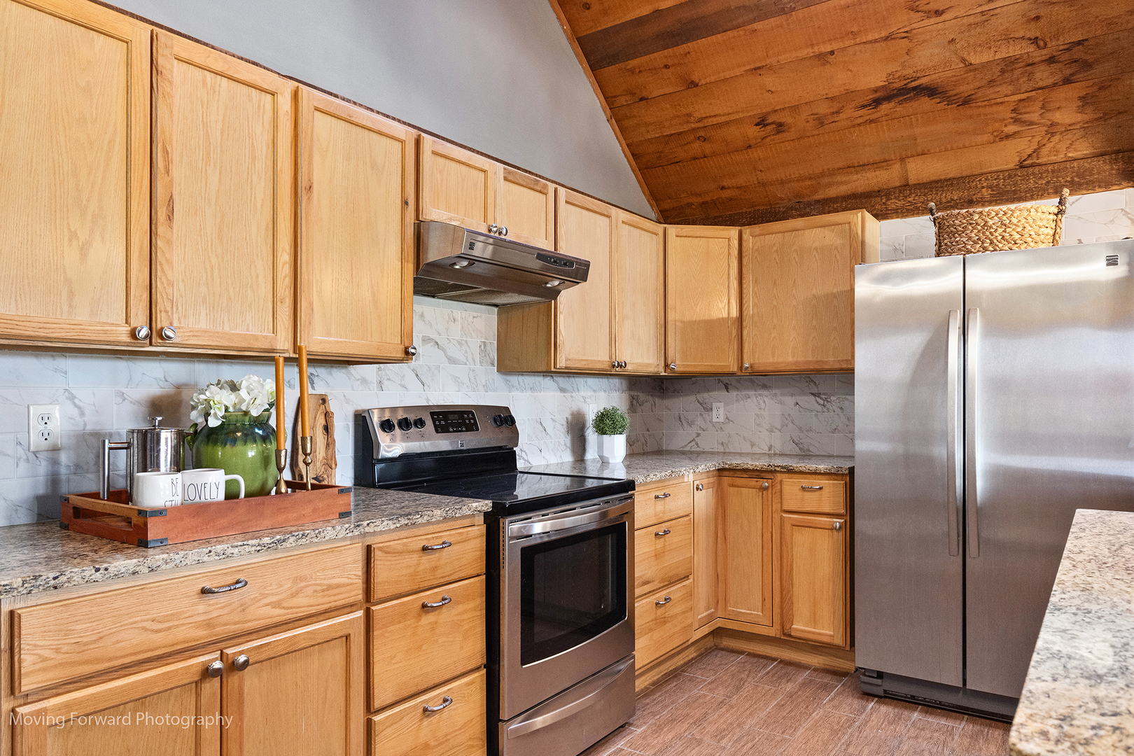 16910 Streit Road Harvard, IL 60033 - Photo 14 of 40 a kitchen with stainless steel appliances granite countertop a refrigerator a sink a stove and white cabinets with wooden floor