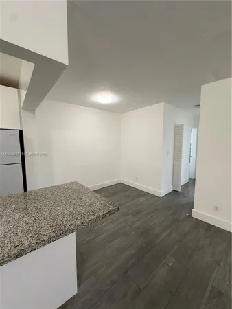 a view of wooden floor and a sink