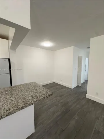 a view of wooden floor and a sink