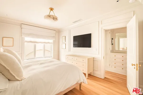 a bedroom with a bed and a table