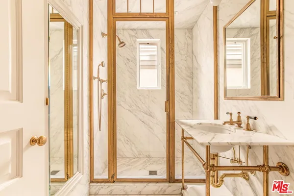 a view of a bathroom with washer and dryer