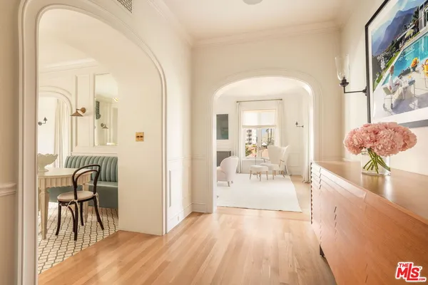 a view of a dining room with furniture and wooden floor