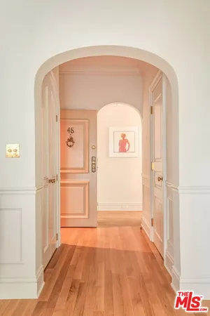 a view of front door with wooden floor