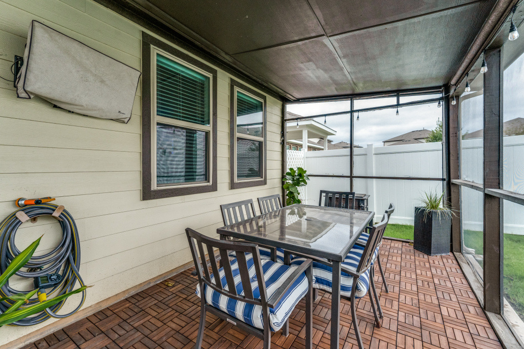 5921 Lehman Way Austin, TX 78747 - Photo 21 of 25 Relax and unwind in this inviting screened-in patio, complete with durable wood tile flooring.