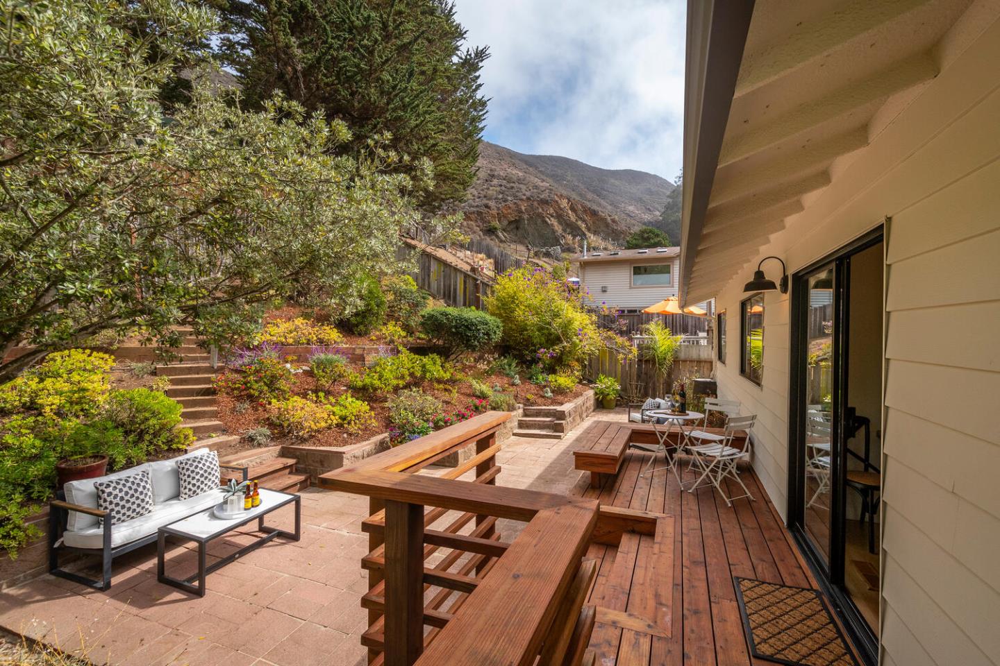 701 Canyon Drive Pacifica, CA 94044 - Photo 11 of 42 a view of a balcony with chairs and wooden floor