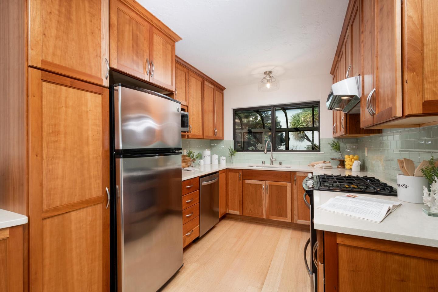 701 Canyon Drive Pacifica, CA 94044 - Photo 14 of 42 a kitchen with stainless steel appliances granite countertop a refrigerator a sink and a stove