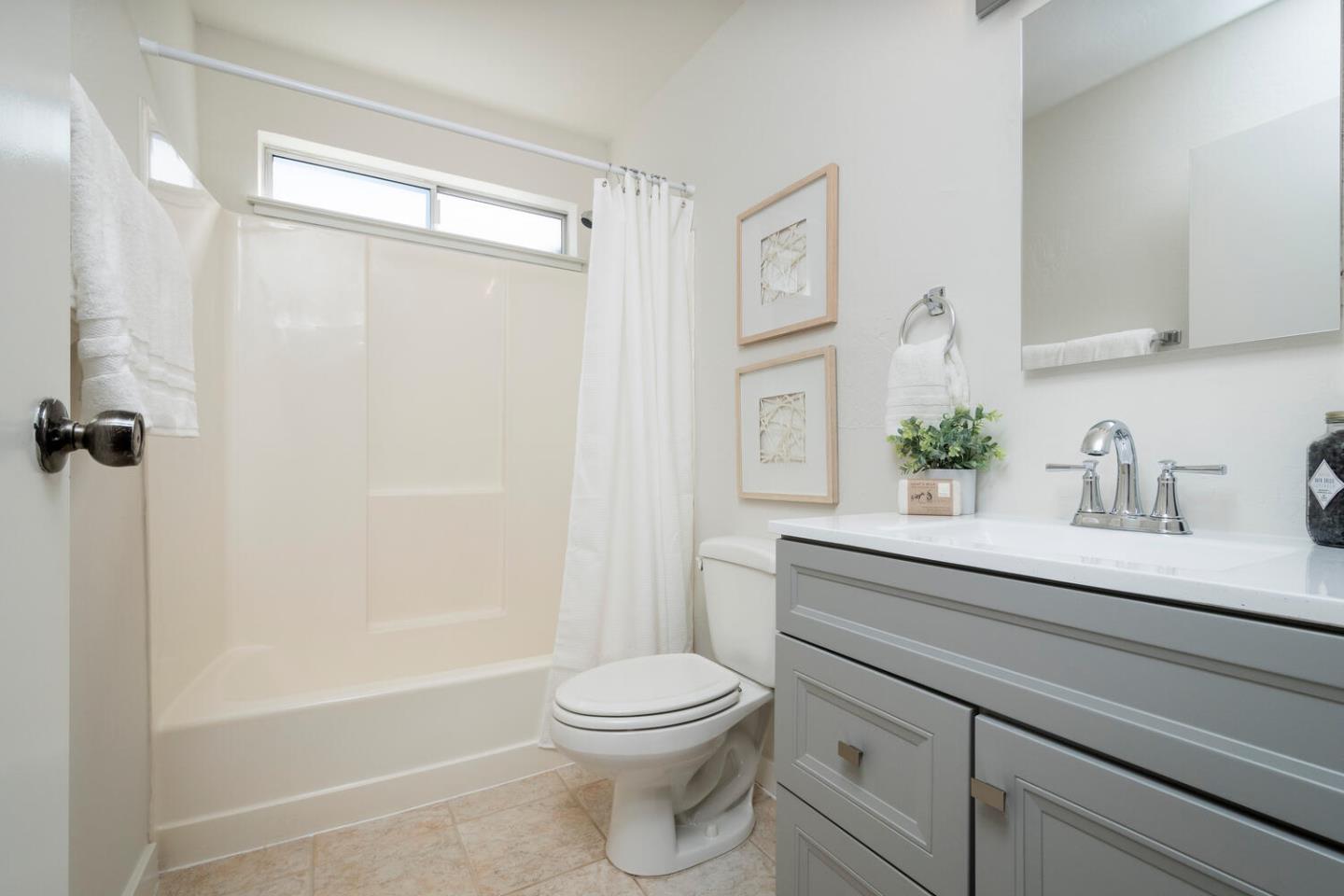 701 Canyon Drive Pacifica, CA 94044 - Photo 19 of 42 a bathroom with a sink a toilet and shower