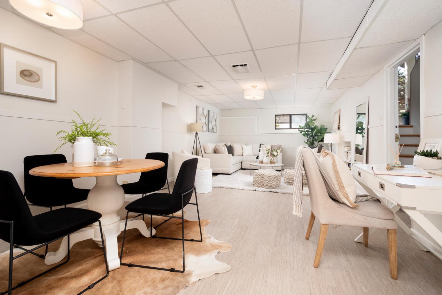 701 Canyon Drive Pacifica, CA 94044 - Photo 23 of 42 a living room with furniture a dining table and a potted plant