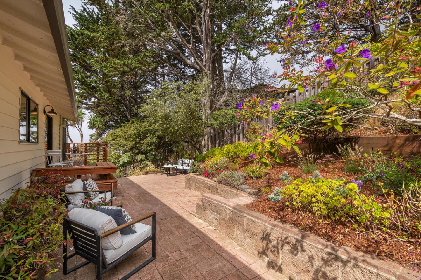 701 Canyon Drive Pacifica, CA 94044 - Photo 29 of 42 a view of backyard with seating space and trees