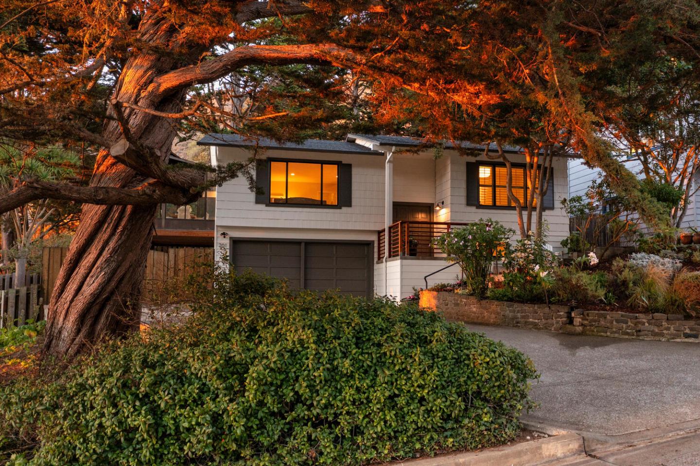701 Canyon Drive Pacifica, CA 94044 - Photo 3 of 42 a front view of a house with a yard