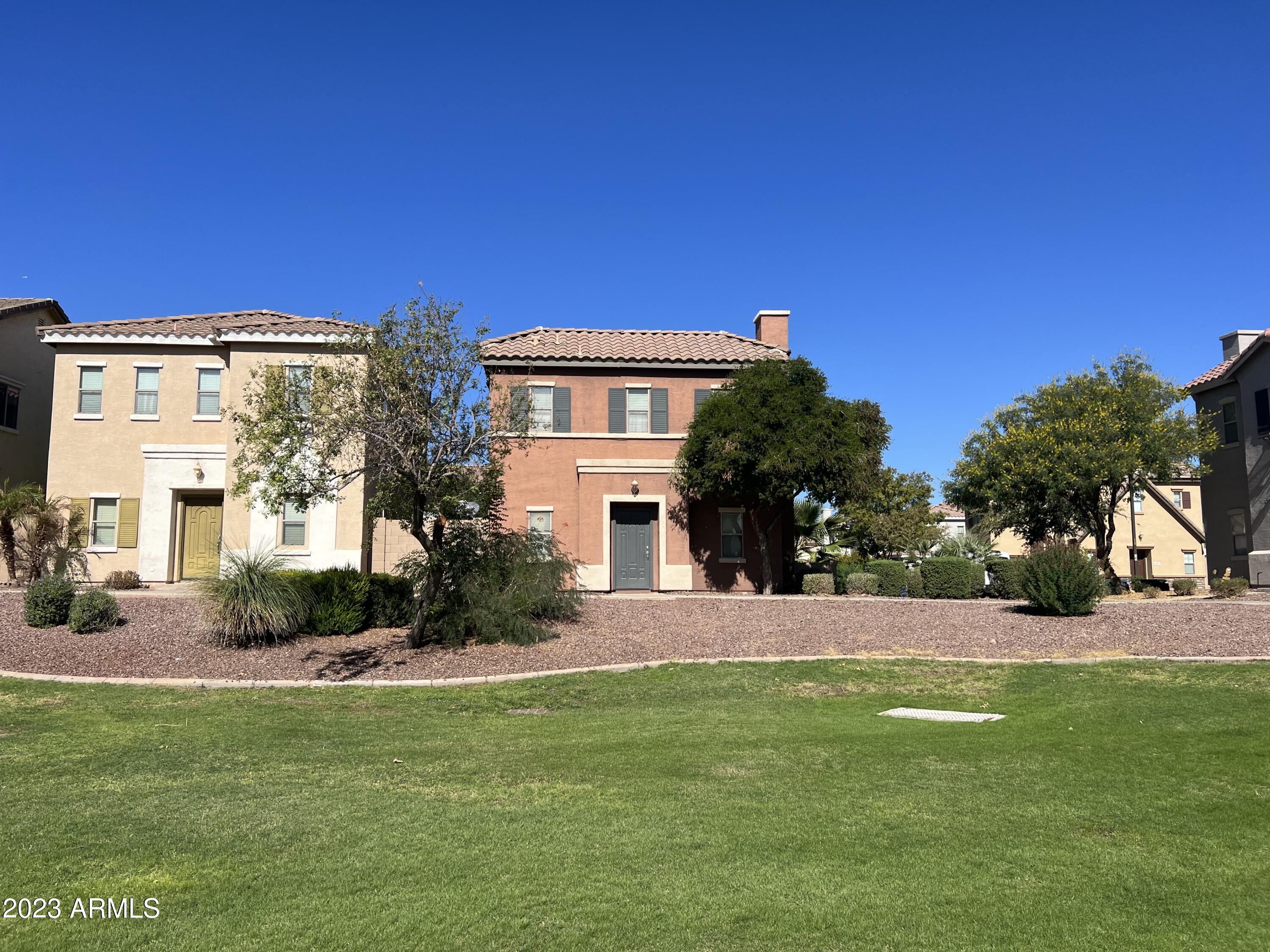 426 North Citrus Lane Gilbert, AZ 85234 - Photo 2 of 3 a front view of a house with a yard