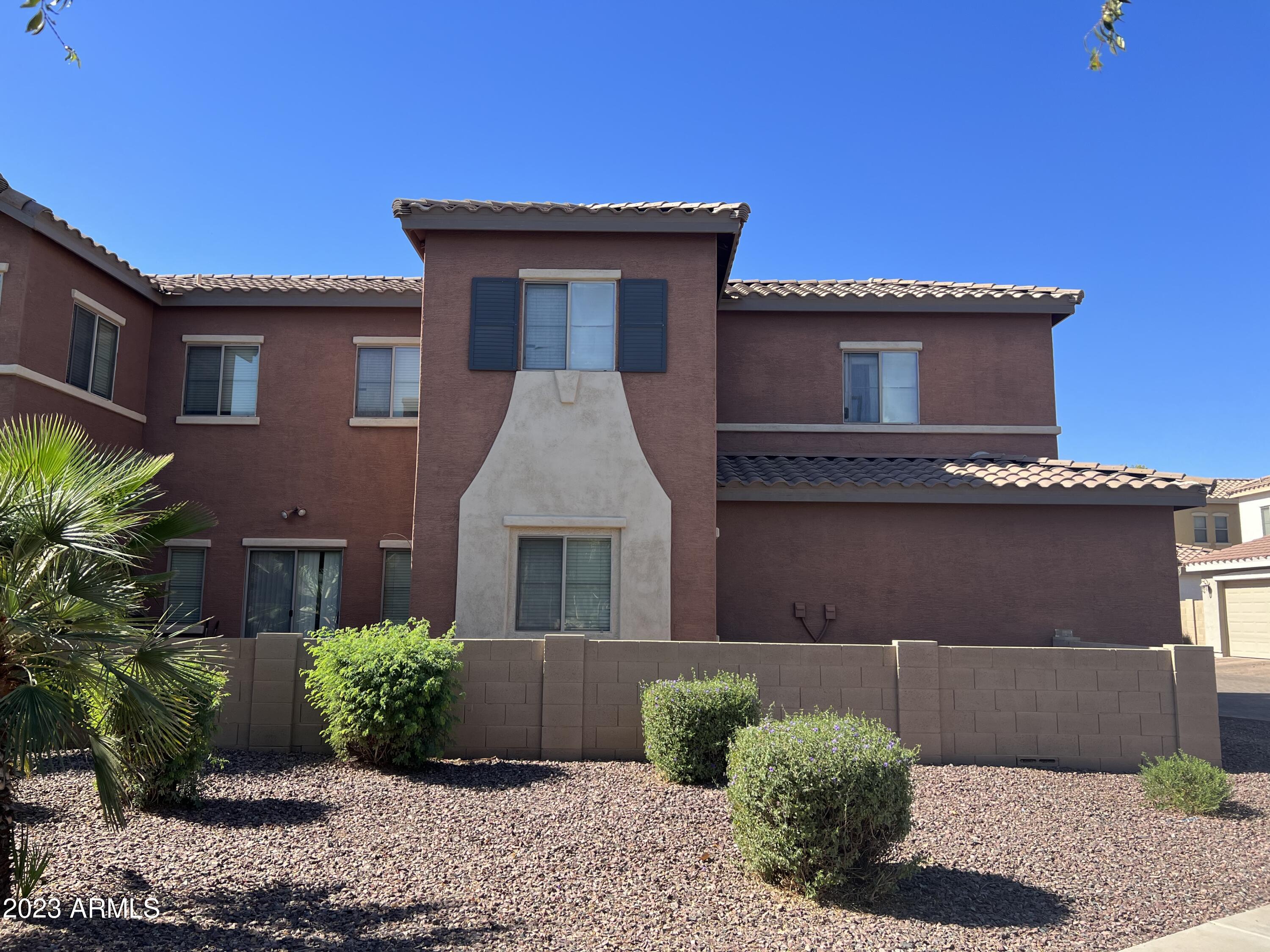 426 North Citrus Lane Gilbert, AZ 85234 - Photo 3 of 3 a front view of a house with garden