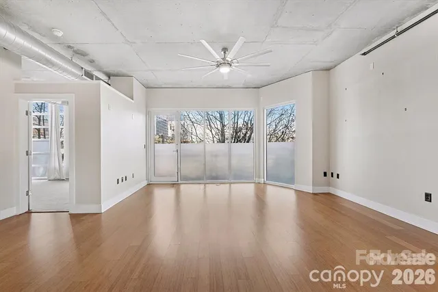 a view of an empty room with a window