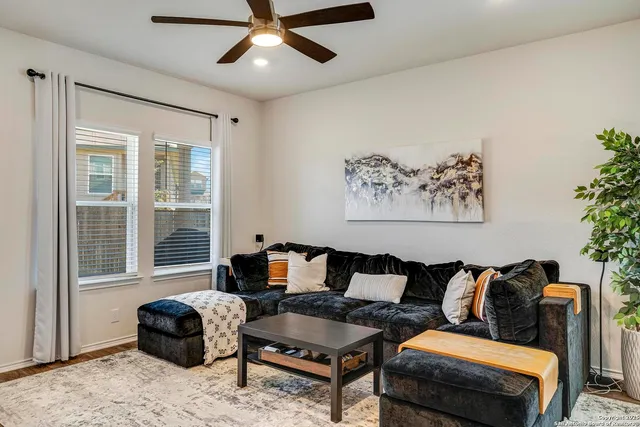 a living room with furniture and a window