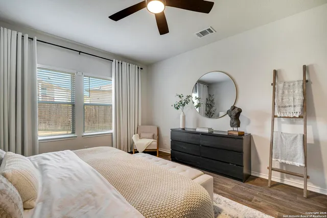 a bedroom with bed and window