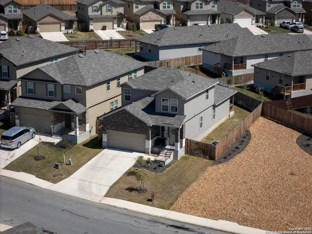 an aerial view of a house with swimming pool