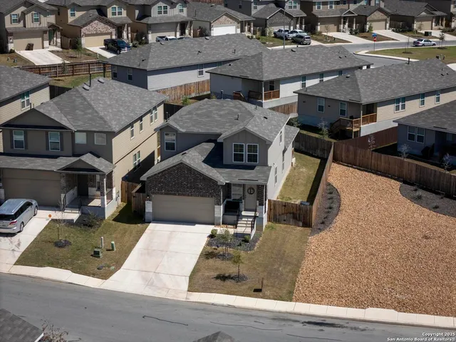 an aerial view of a house with swimming pool