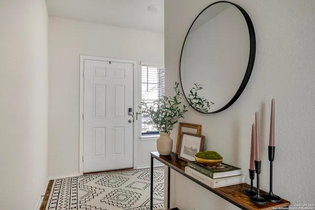 a view of a livingroom with furniture and a mirror