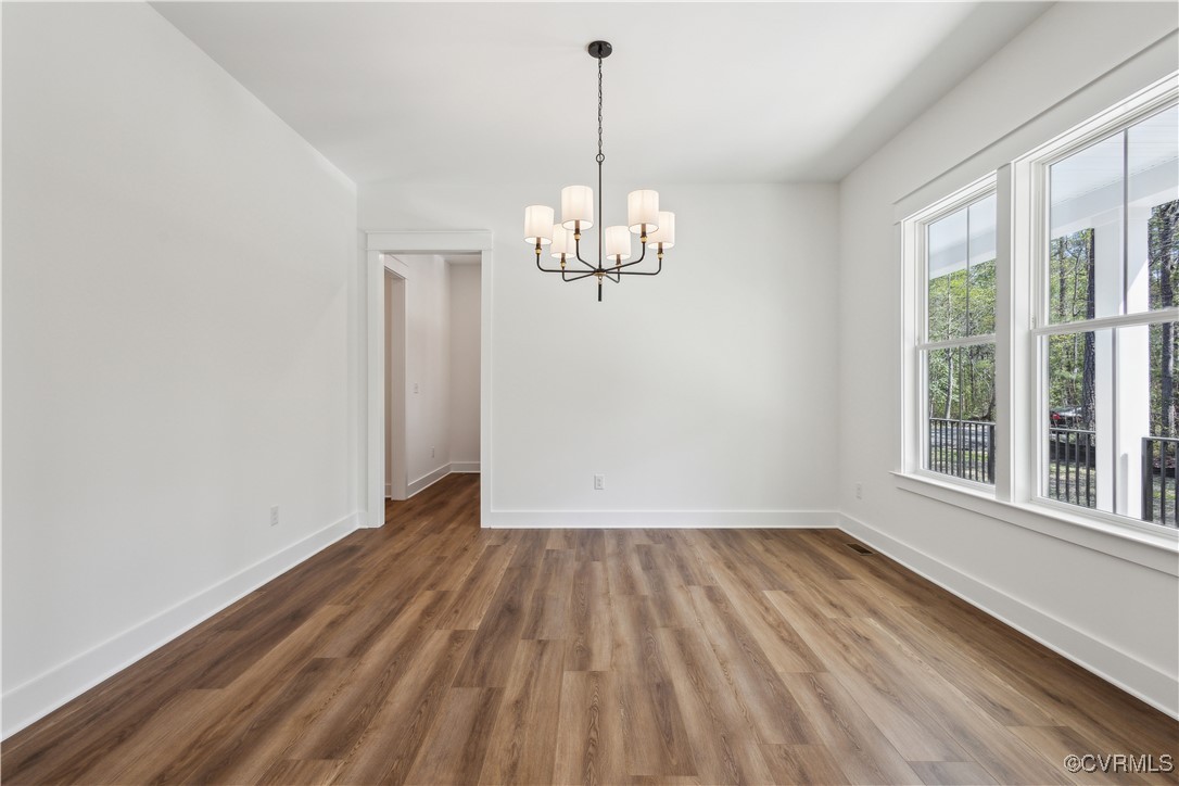 4750 Studley Road Mechanicsville, VA 23116 - Photo 11 of 36 a view of empty room with wooden floor and fan