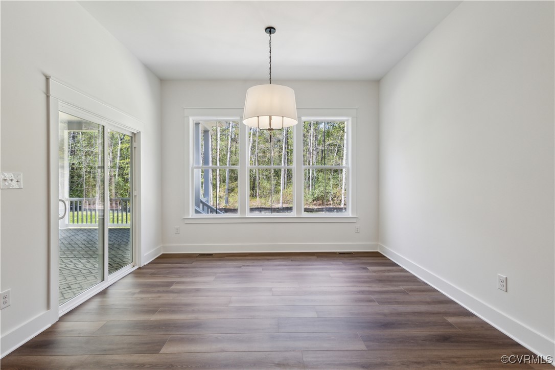 4750 Studley Road Mechanicsville, VA 23116 - Photo 13 of 36 an empty room with wooden floor and windows