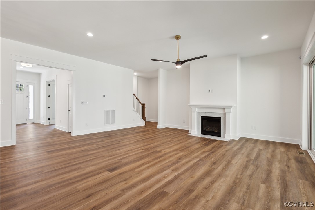 4750 Studley Road Mechanicsville, VA 23116 - Photo 14 of 36 a view of empty room with wooden floor and fireplace