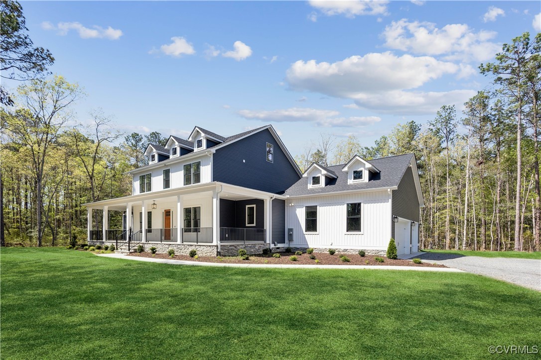 4750 Studley Road Mechanicsville, VA 23116 - Photo 3 of 36 a front view of a house with a garden