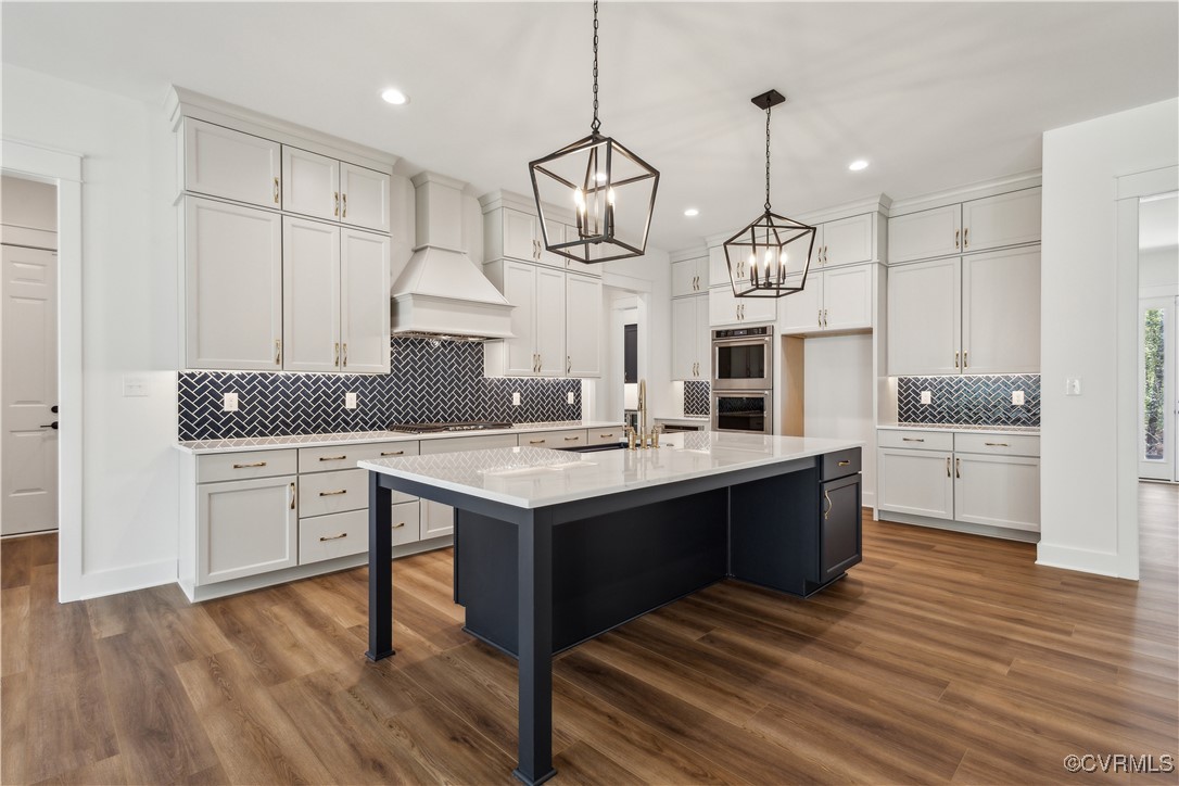 4750 Studley Road Mechanicsville, VA 23116 - Photo 4 of 36 a kitchen with granite countertop a sink cabinets and wooden floor