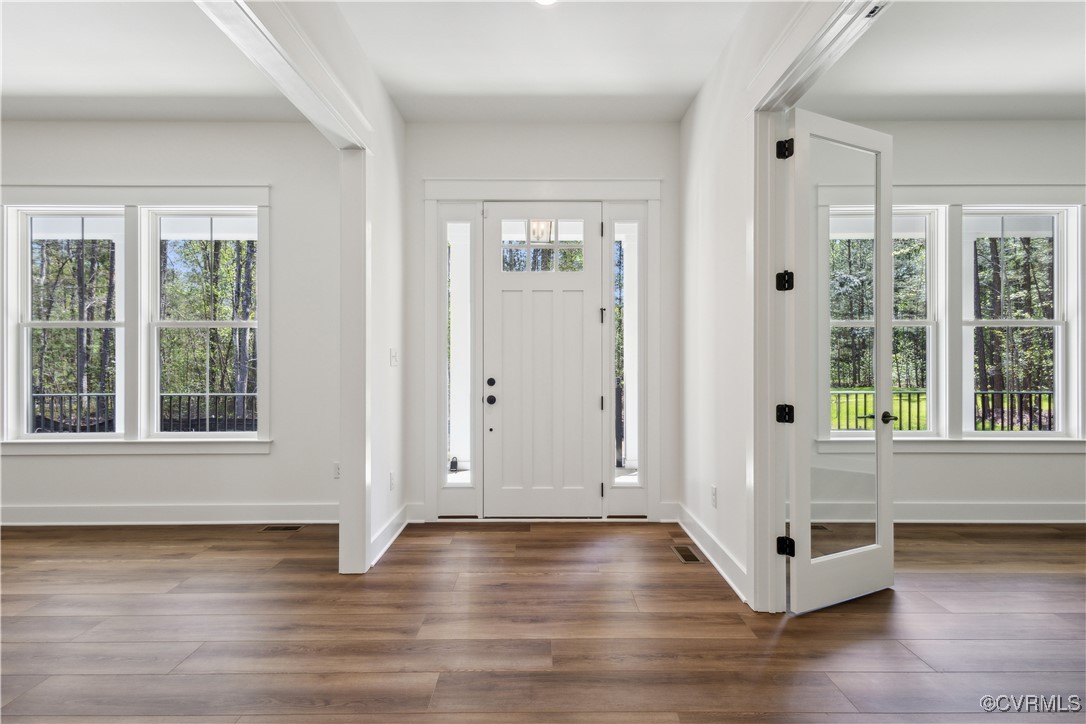 4750 Studley Road Mechanicsville, VA 23116 - Photo 9 of 36 an empty room with wooden floor and windows