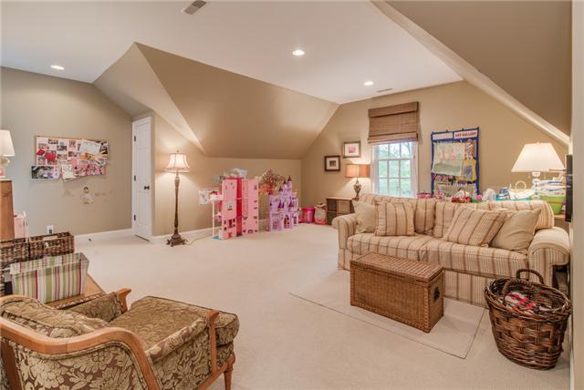 129 Alton Road Nashville, TN 37205 - Photo 13 of 20 a living room with furniture gym equipment and a large window