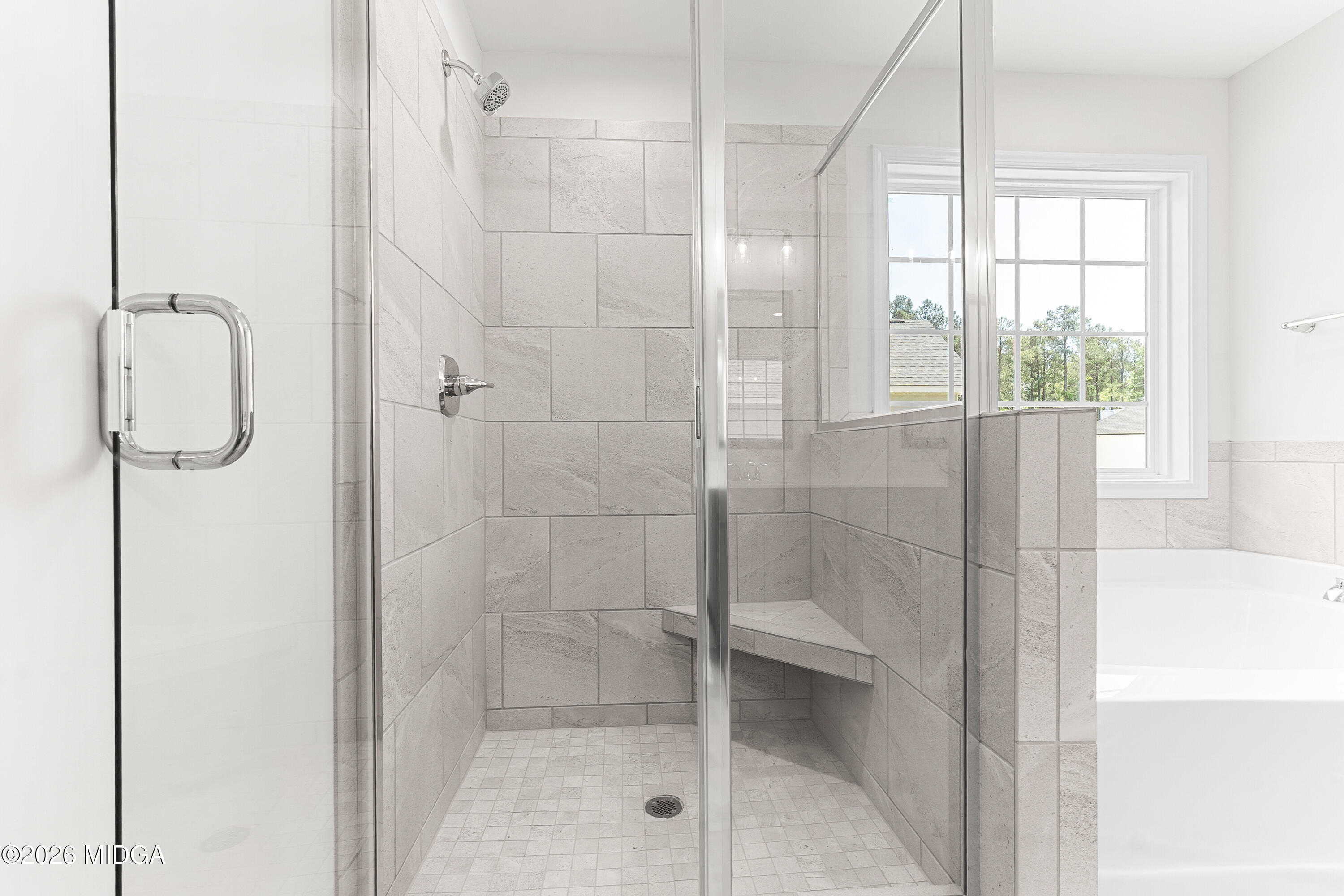 5393 Felles Way, Unit 359 Forsyth, GA 31029 - Photo 36 of 54 a bathroom with a glass shower door