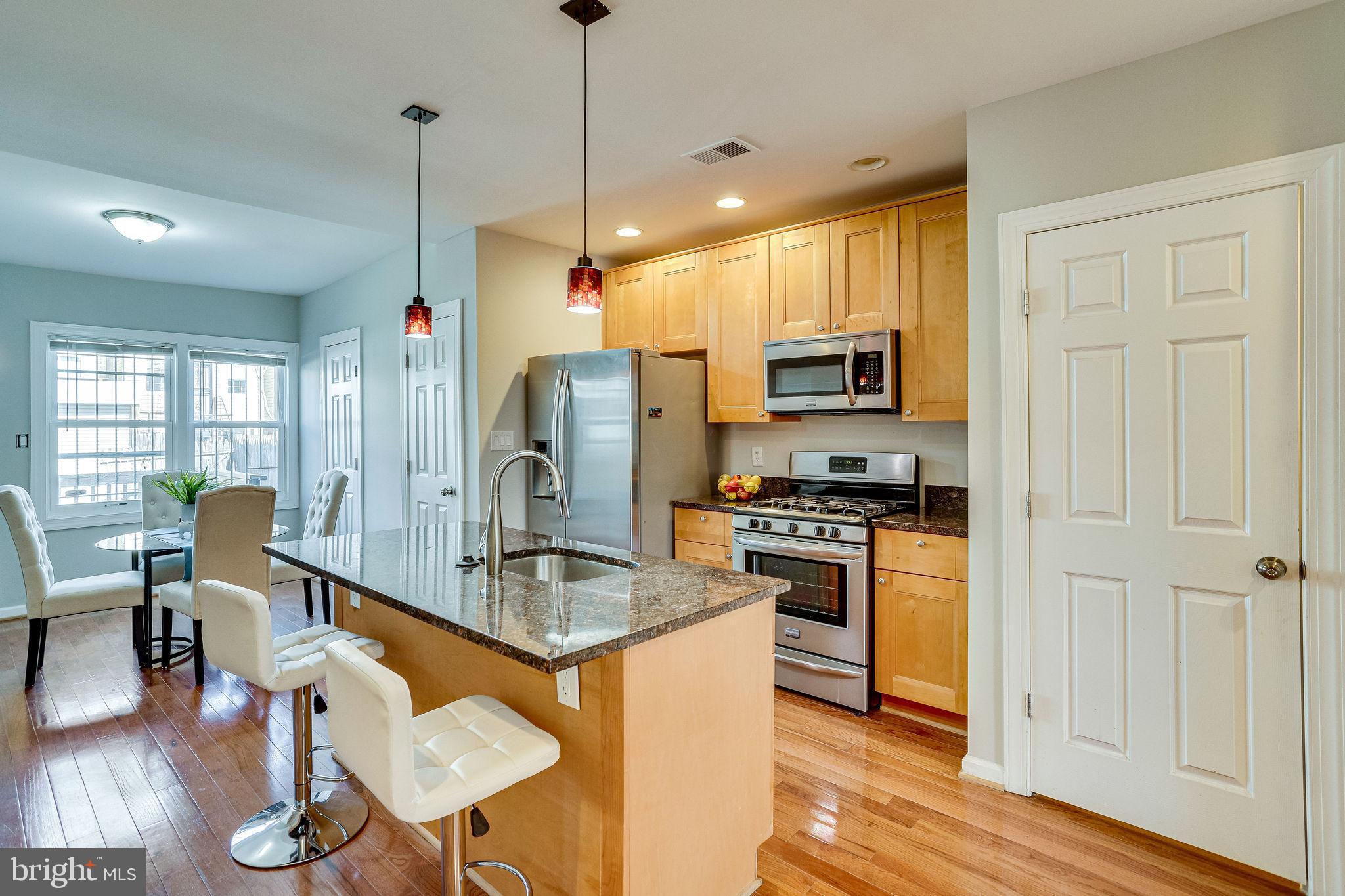 1928 Bennett Place Northeast Washington, DC 20002 - Photo 9 of 40 Open kitchen w/ stainless and granite
