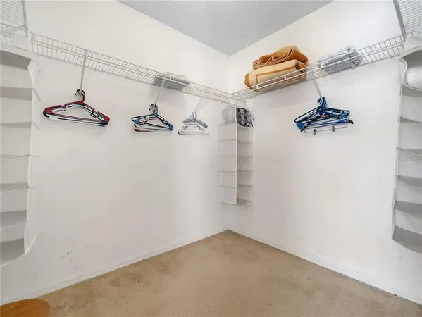 a bedroom with a bed and a table