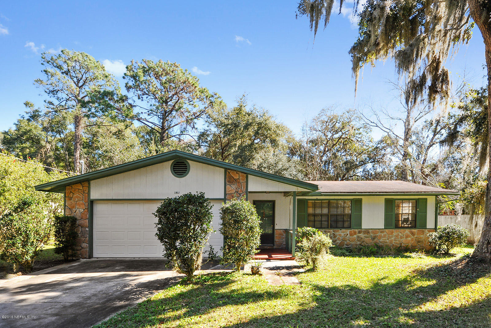 161 Drake Road St. Augustine, FL 32086 - Photo 1 of 15 a view of a yard in front of a house with a large tree