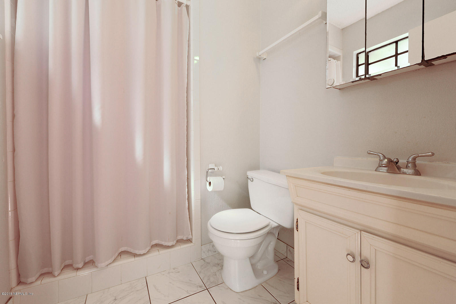 161 Drake Road St. Augustine, FL 32086 - Photo 14 of 15 a bathroom with a sink a toilet and shower curtain