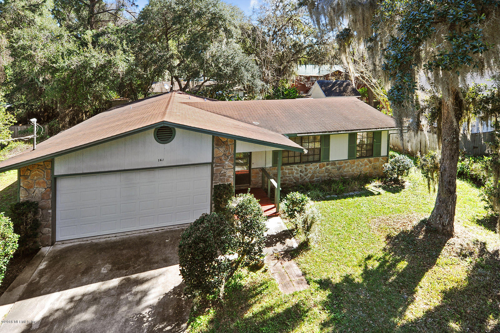 161 Drake Road St. Augustine, FL 32086 - Photo 2 of 15 a house with trees in the background