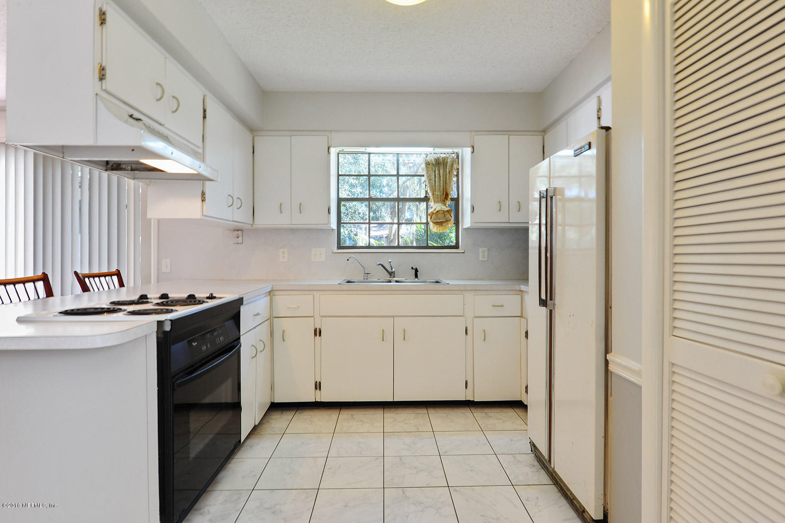 161 Drake Road St. Augustine, FL 32086 - Photo 7 of 15 a kitchen with a sink stove and refrigerator