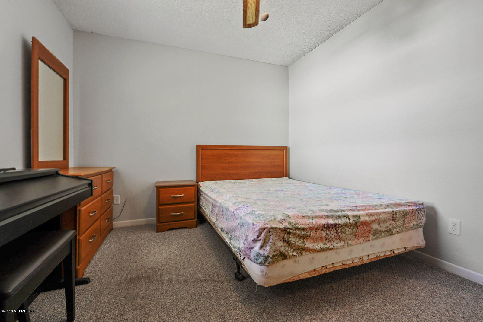 161 Drake Road St. Augustine, FL 32086 - Photo 10 of 15 a bedroom with a bed and a dresser