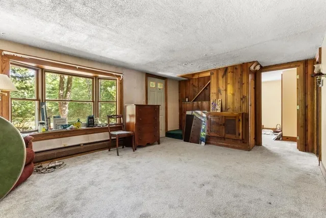 a view of a big room with furniture and balcony