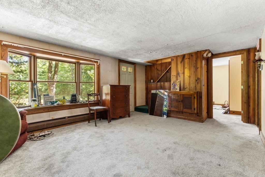627 First Parish Road Scituate, MA 02066 - Photo 13 of 33 a view of a big room with furniture and balcony