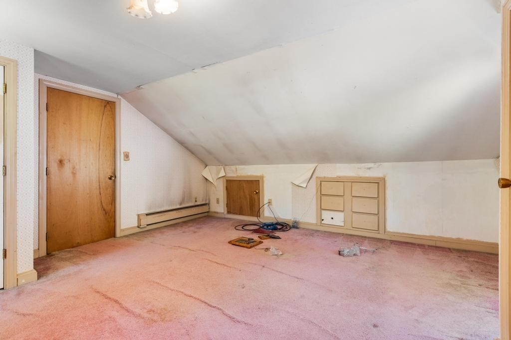 627 First Parish Road Scituate, MA 02066 - Photo 21 of 33 a view of a livingroom with a staircase and a sink