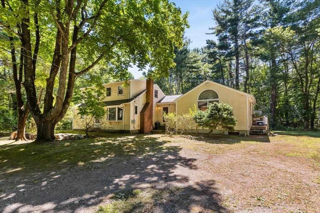 627 First Parish Road Scituate, MA 02066 - Photo 24 of 33 a front view of a house with a yard
