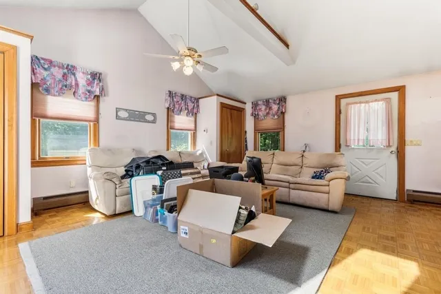 a living room with furniture and a chandelier