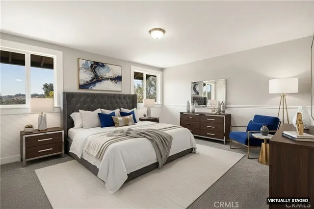 a bedroom with a bed and lamp