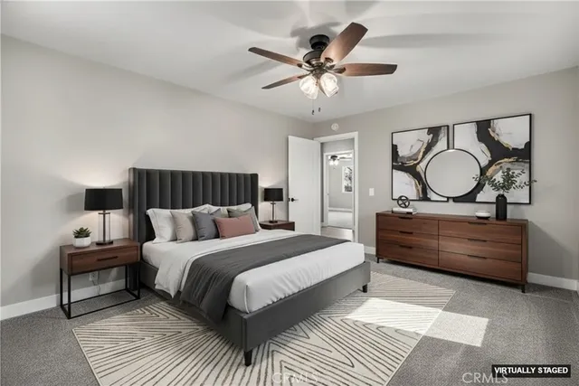 a bed room with a bed and a chandelier