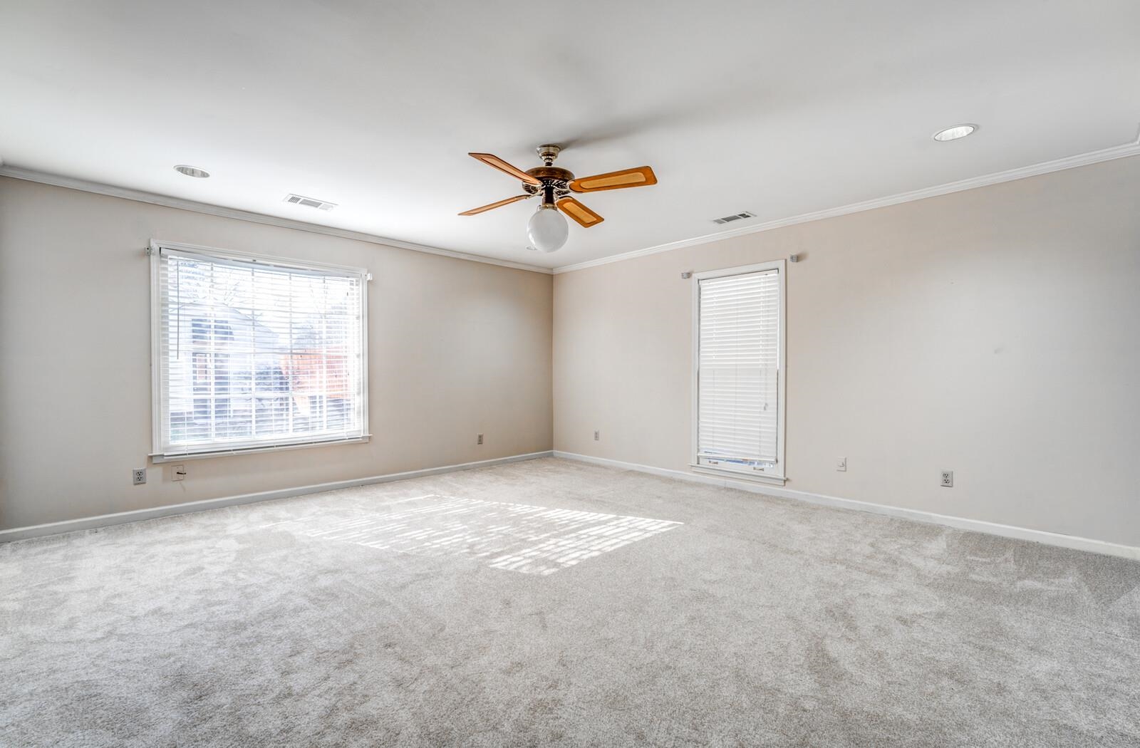 2997 Riverdale Road Memphis, TN 38119 - Photo 15 of 35 Carpeted spare room with ceiling fan and crown molding
