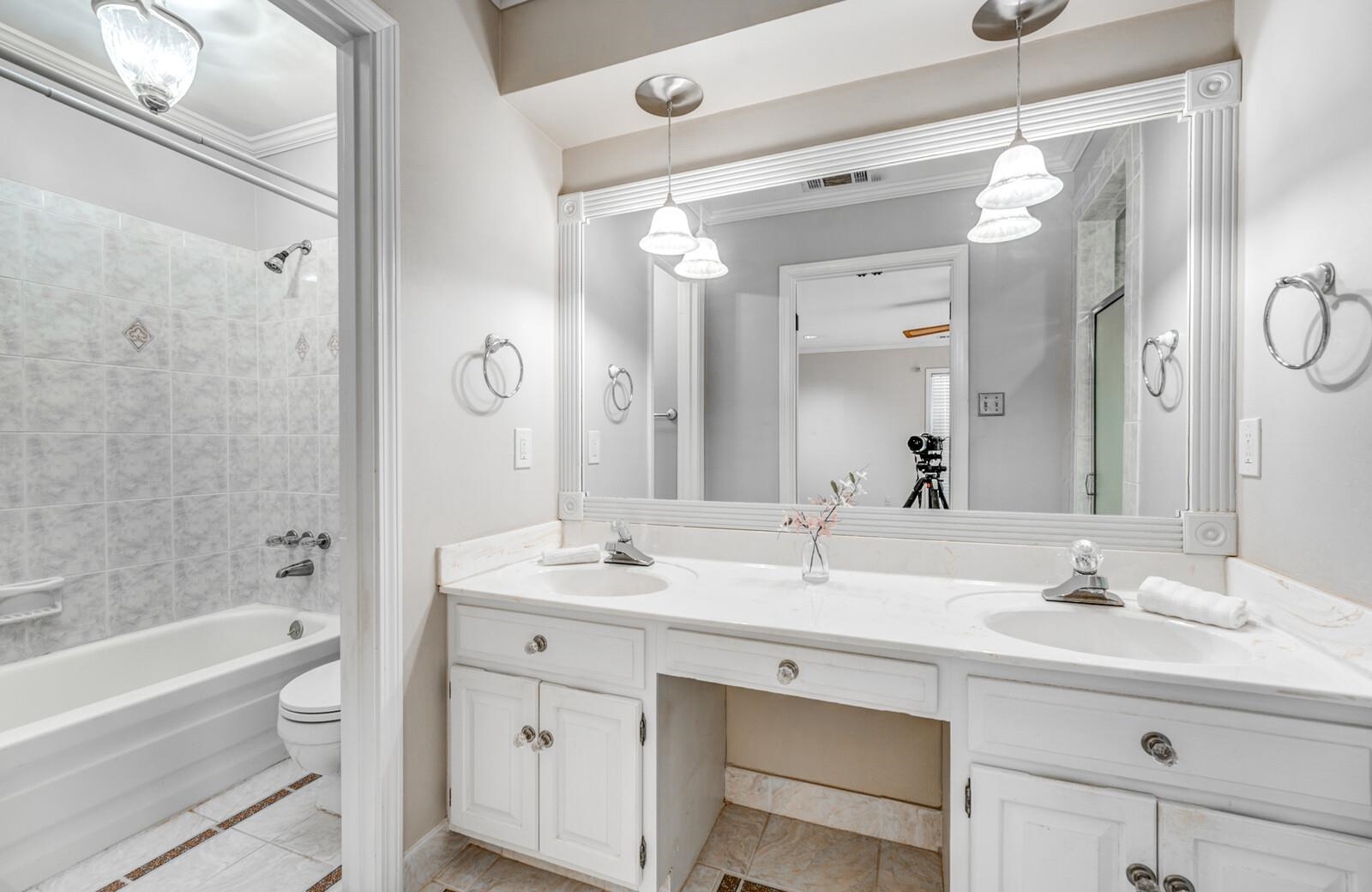 2997 Riverdale Road Memphis, TN 38119 - Photo 18 of 35 Bathroom featuring double vanity, ornamental molding, and shower / tub combination