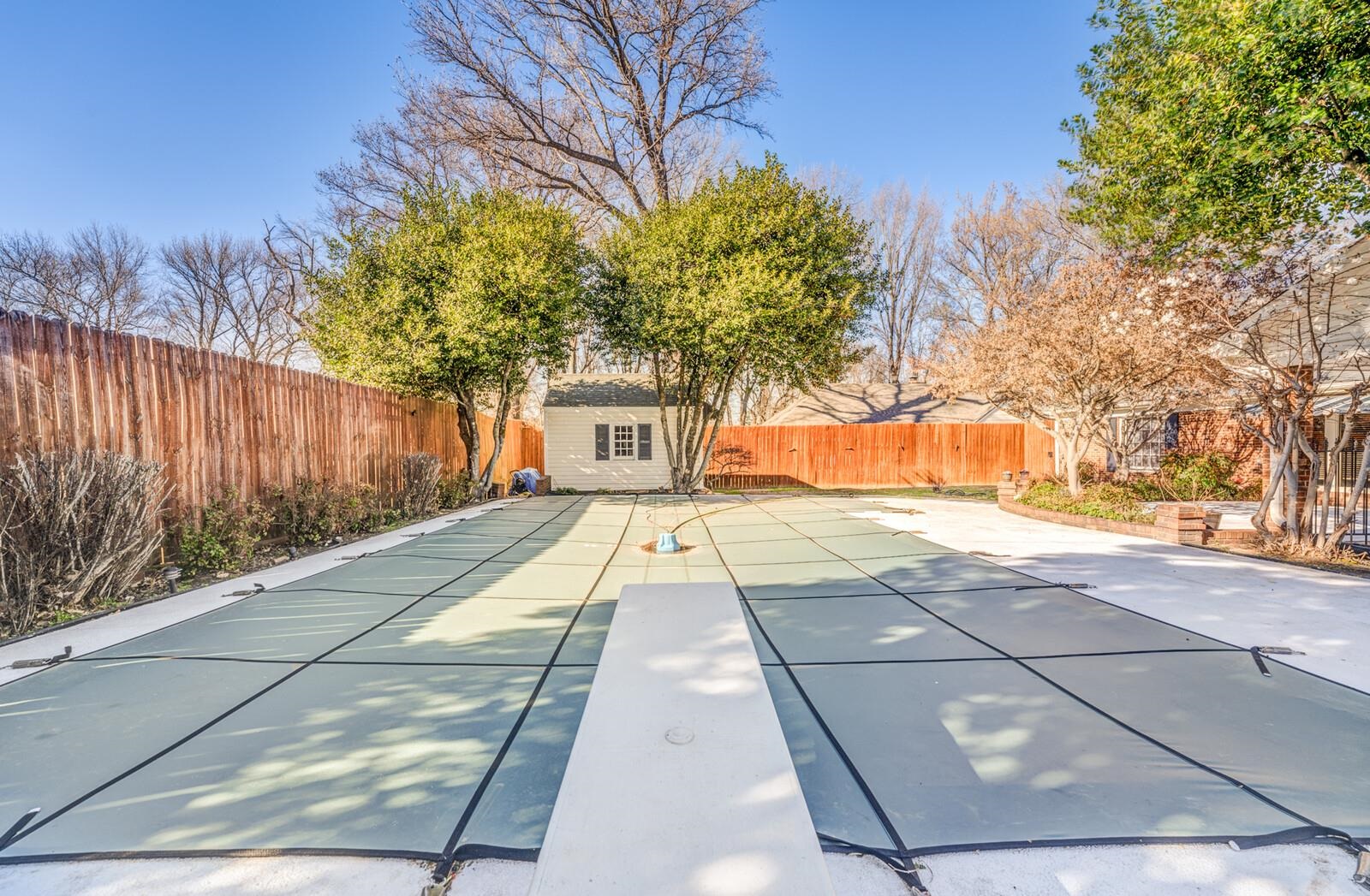 2997 Riverdale Road Memphis, TN 38119 - Photo 29 of 35 View of swimming pool featuring a fenced backyard, patio surround, and an outbuilding