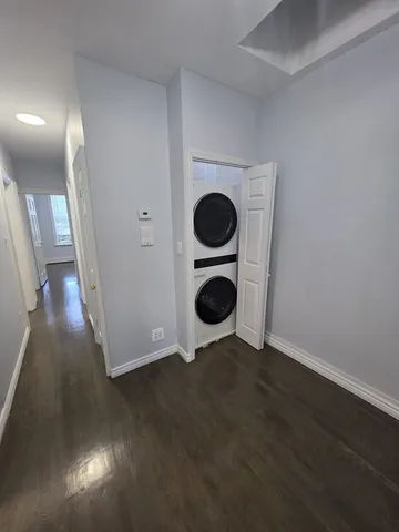an entryway with wooden floor