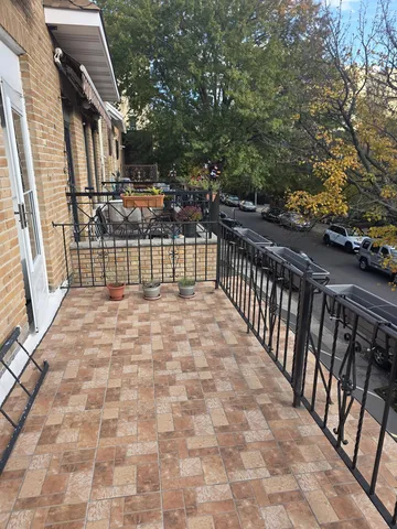 a view of balcony with wooden floor