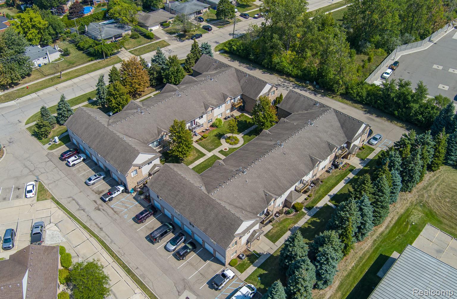 2154 Frazho Road Warren, MI 48091 - Photo 30 of 36 Aerial perspective showcasing a multi-unit property with a central landscaped courtyard